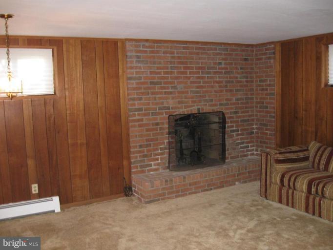5319 Wakefield Road Bethesda, MD 20816 - Photo 24 of 29 Recreation room with wood-burning fireplace