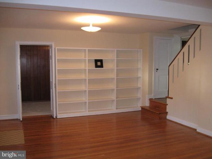 5319 Wakefield Road Bethesda, MD 20816 - Photo 6 of 29 Living room with removable shelving and Den access
