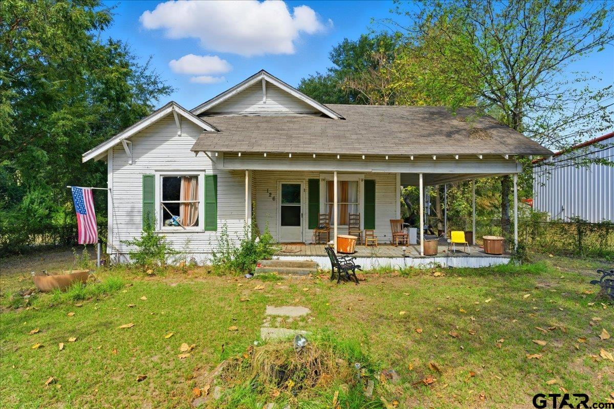 a front view of house with yard and porch