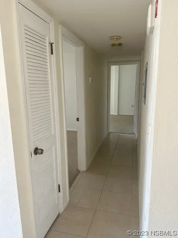 a view of a hallway with a door