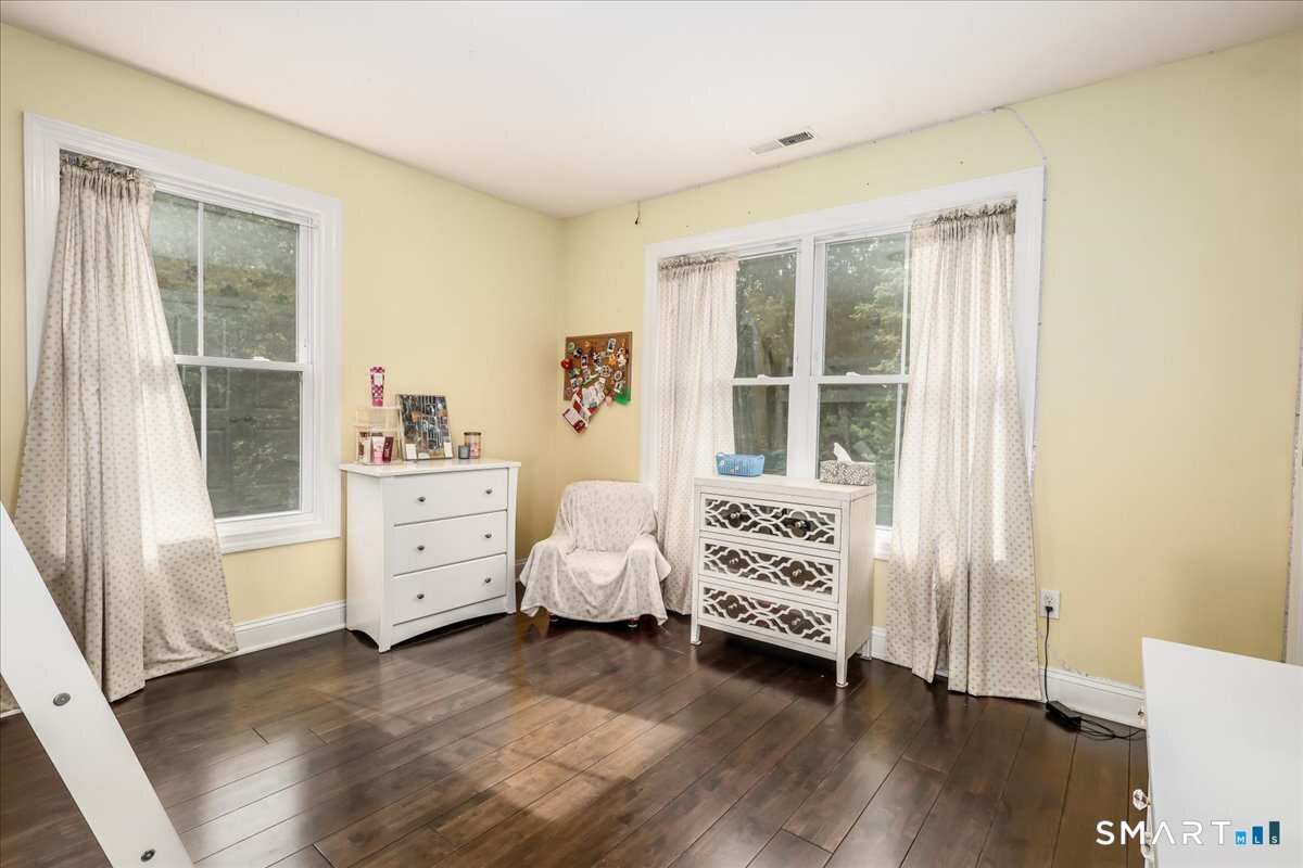 127 Putnam Park Road Bethel, CT 06801 - Photo 18 of 35 a view of livingroom with furniture and windows
