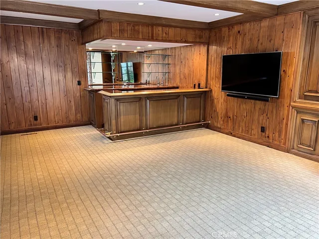 a view of a kitchen with wooden floor and a kitchen space