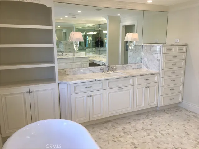 a bathroom with a sink and mirror