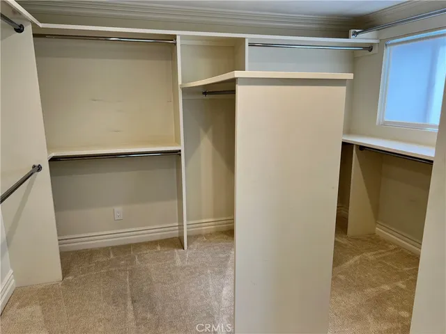 a view of gallery with wooden floor