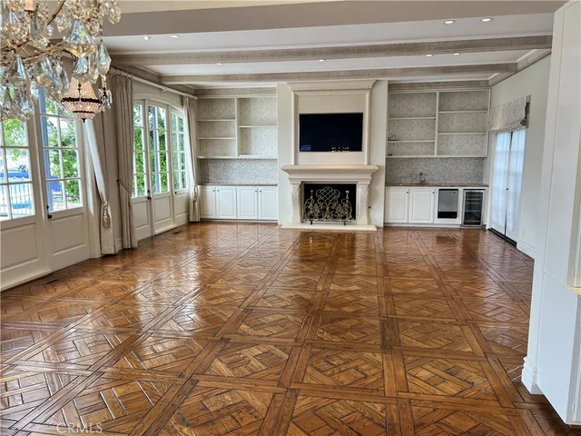 a view of a livingroom with an empty space and a fireplace
