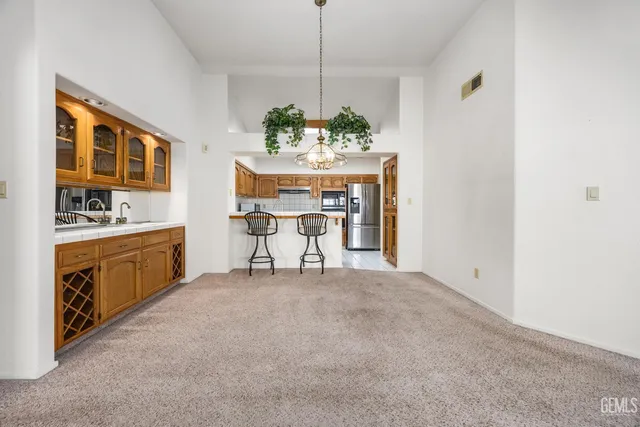 a dining room with furniture and a chandelier