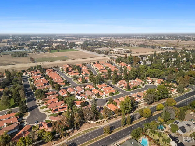 an aerial view of beach and city