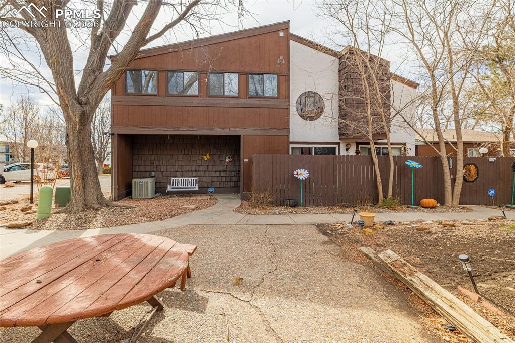 130 Scotland Road, Unit D Pueblo, CO 81001 - Photo 1 of 20 a front view of a house with a yard