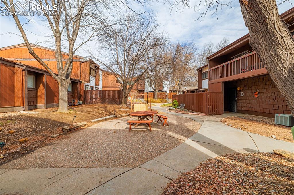 130 Scotland Road, Unit D Pueblo, CO 81001 - Photo 18 of 20 a bench is sitting in middle of a yard
