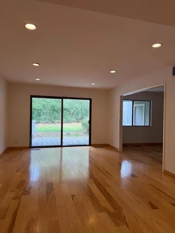 a kitchen with a refrigerator sink and cabinets