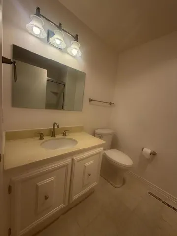 a bathroom with a glass shower door