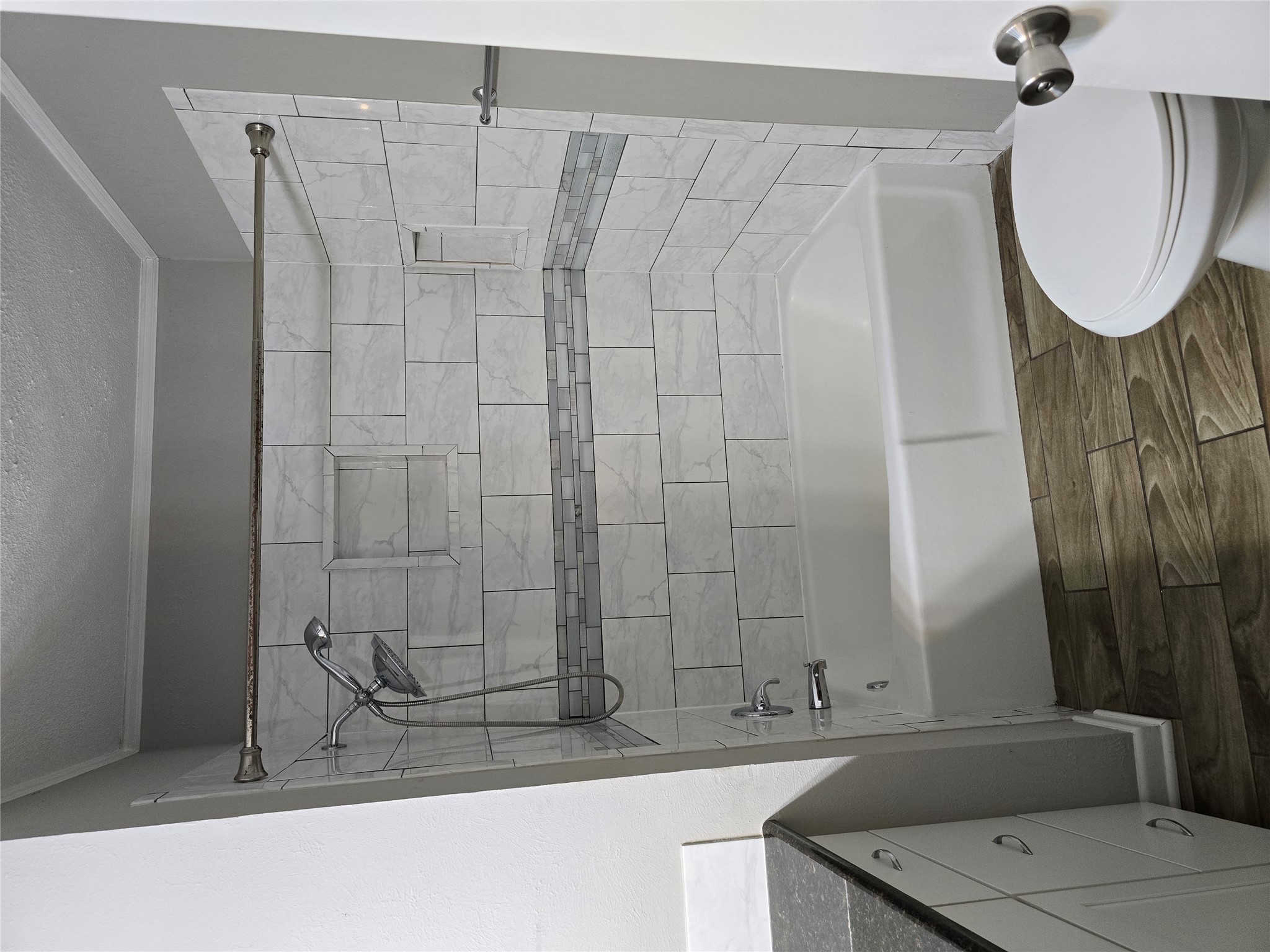 205 East Cherokee Drive Harker Heights, TX 76548 - Photo 13 of 23 A pristine tub and shower combination with stylish tilework provides a relaxing retreat.