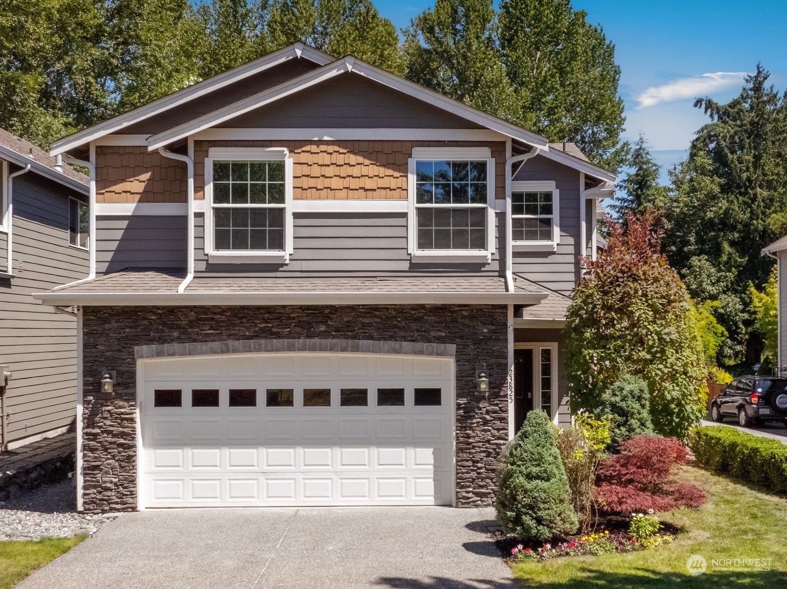 a front view of a house with a yard