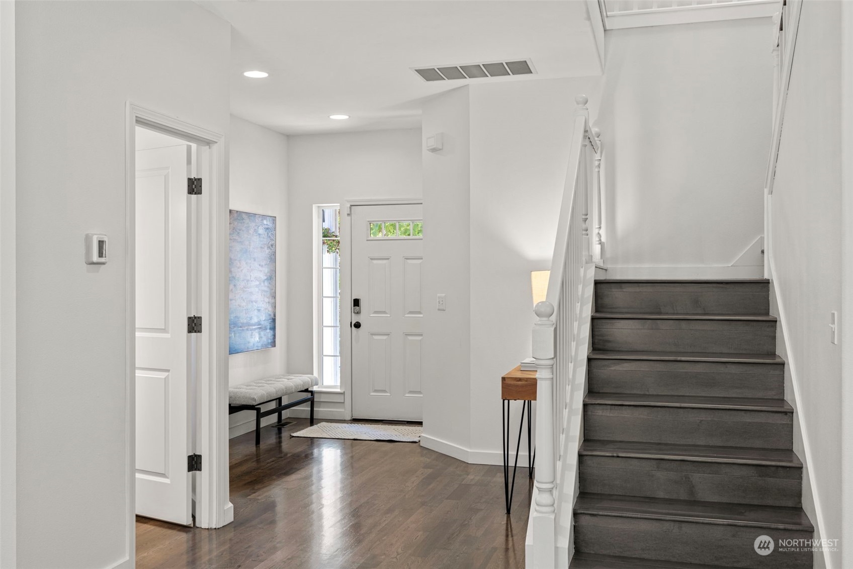 23825 17th Avenue West Bothell, WA 98021 - Photo 17 of 35 a view of a hallway with wooden floor and staircase