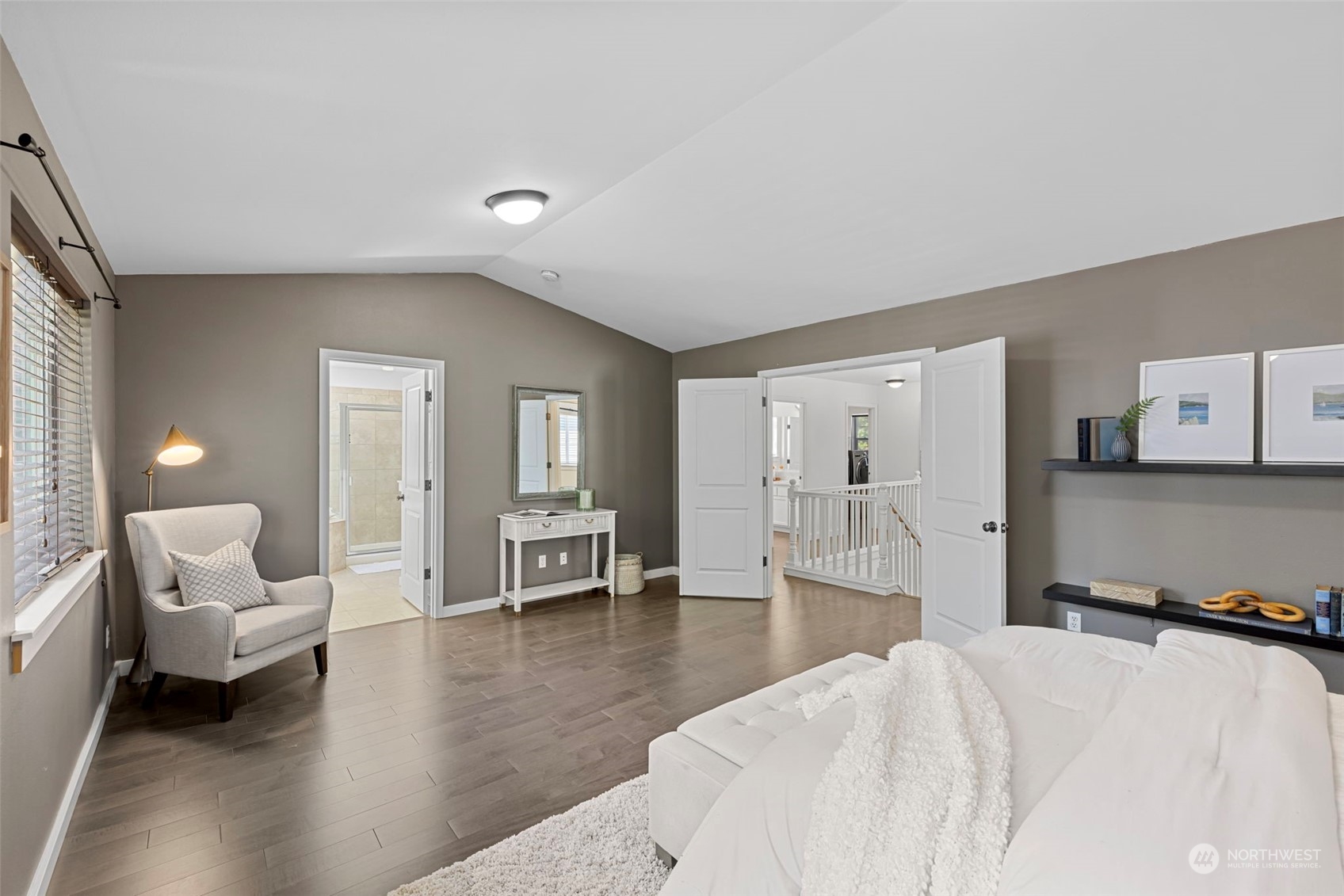 23825 17th Avenue West Bothell, WA 98021 - Photo 19 of 35 a spacious bedroom with a bed a couch and a view of living room
