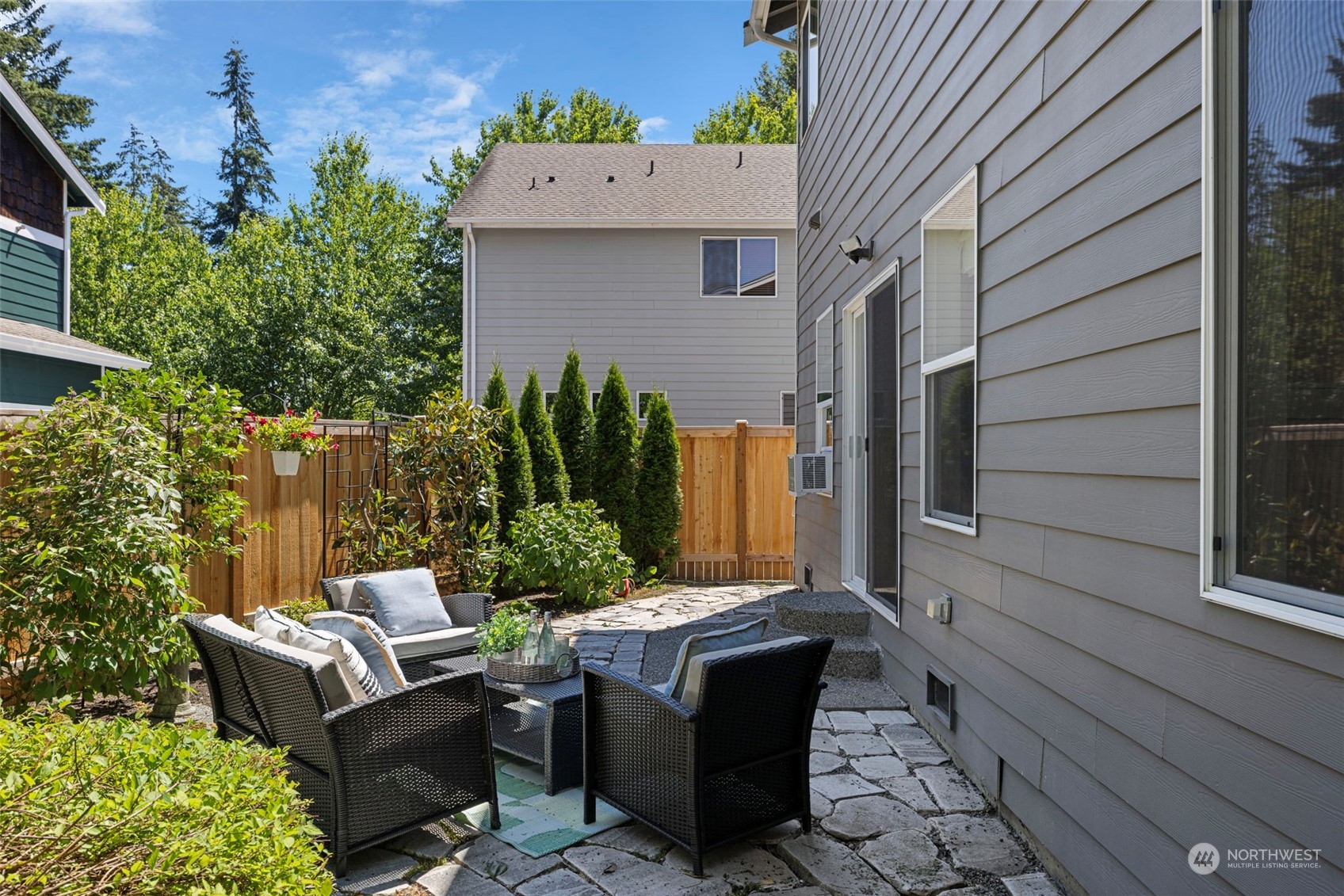 23825 17th Avenue West Bothell, WA 98021 - Photo 27 of 35 a view of a patio with couches table and chairs and potted plants