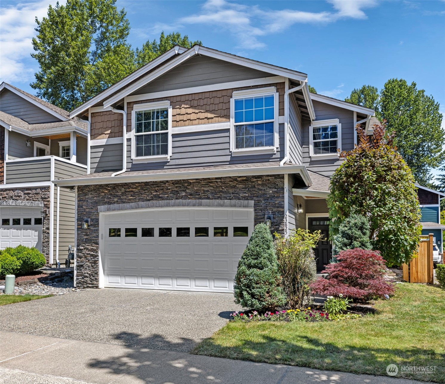 23825 17th Avenue West Bothell, WA 98021 - Photo 29 of 35 a front view of a house with a yard and garage