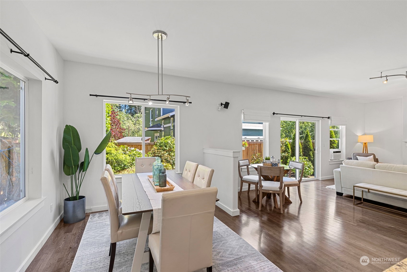 23825 17th Avenue West Bothell, WA 98021 - Photo 5 of 35 a dining room with furniture a chandelier and wooden floor