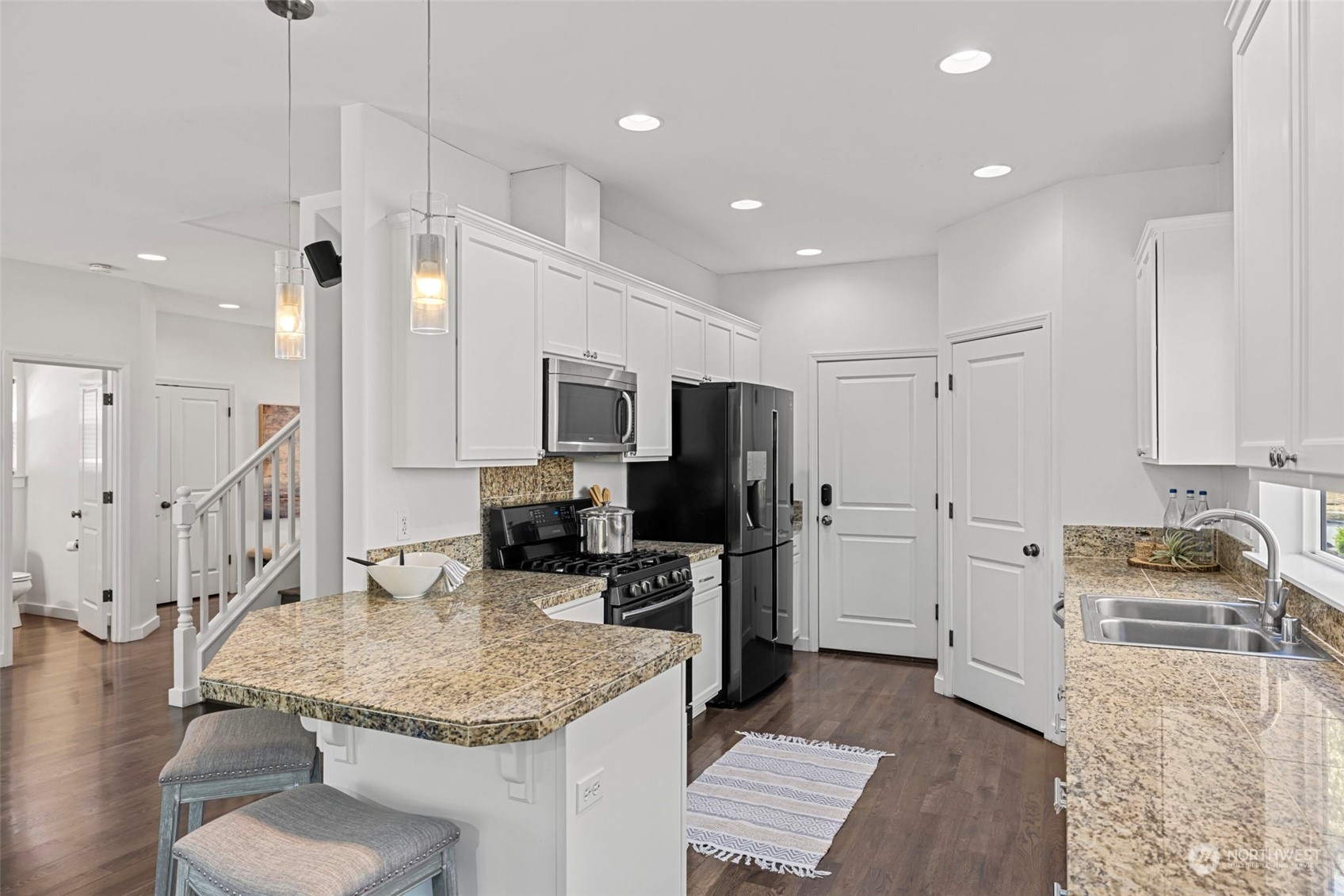 23825 17th Avenue West Bothell, WA 98021 - Photo 9 of 35 a kitchen with stainless steel appliances granite countertop a sink refrigerator and cabinets