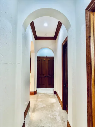 a kitchen with stainless steel appliances kitchen island granite countertop a stove a sink and a refrigerator