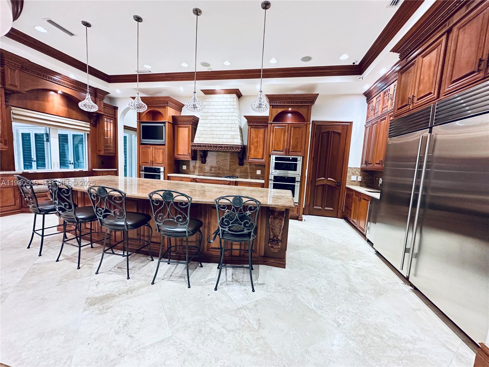 6180 Southwest 132nd Street Pinecrest, FL 33156 - Photo 16 of 75 a view of a dining room with furniture