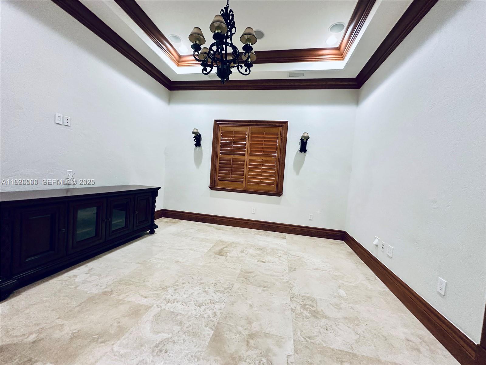 6180 Southwest 132nd Street Pinecrest, FL 33156 - Photo 21 of 75 a view of an empty room with a window