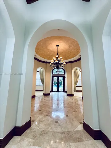 a view of a room with a fireplace and window