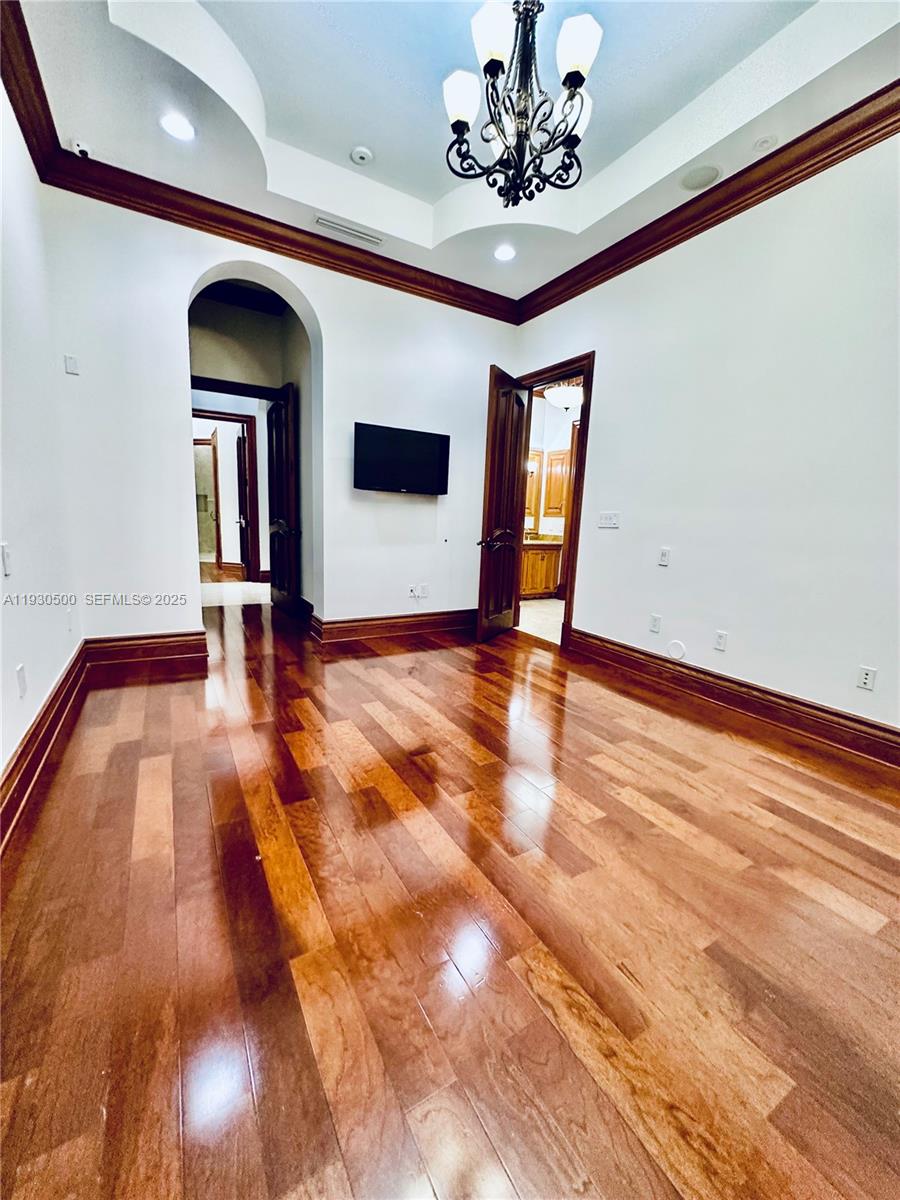 6180 Southwest 132nd Street Pinecrest, FL 33156 - Photo 33 of 75 a view of an entryway with a chandelier