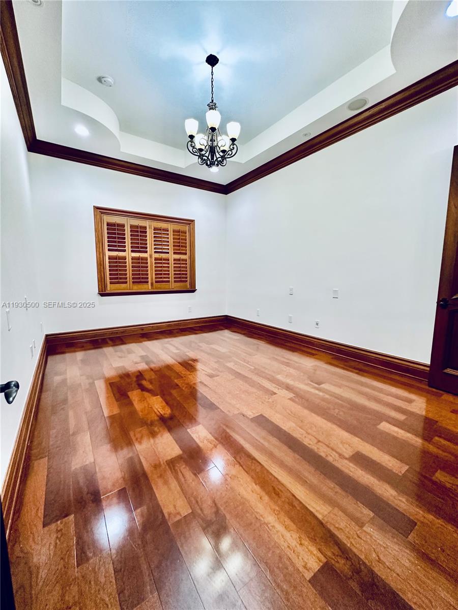 6180 Southwest 132nd Street Pinecrest, FL 33156 - Photo 42 of 75 a view of an empty room with a chandelier