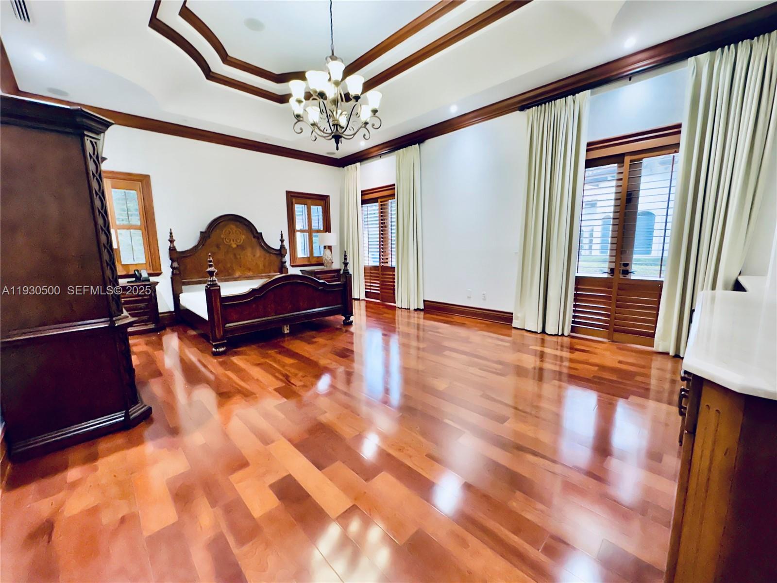 6180 Southwest 132nd Street Pinecrest, FL 33156 - Photo 44 of 75 a view of a livingroom with furniture staircase and a chandelier