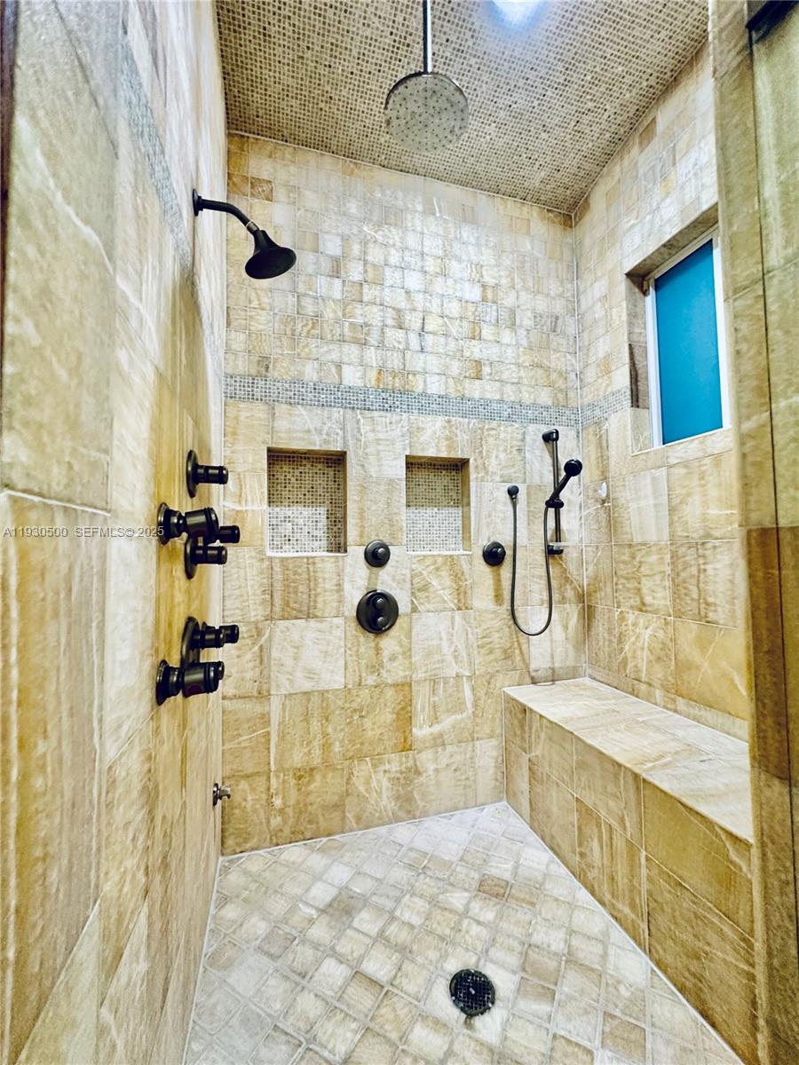 6180 Southwest 132nd Street Pinecrest, FL 33156 - Photo 48 of 75 a bathroom with a shower