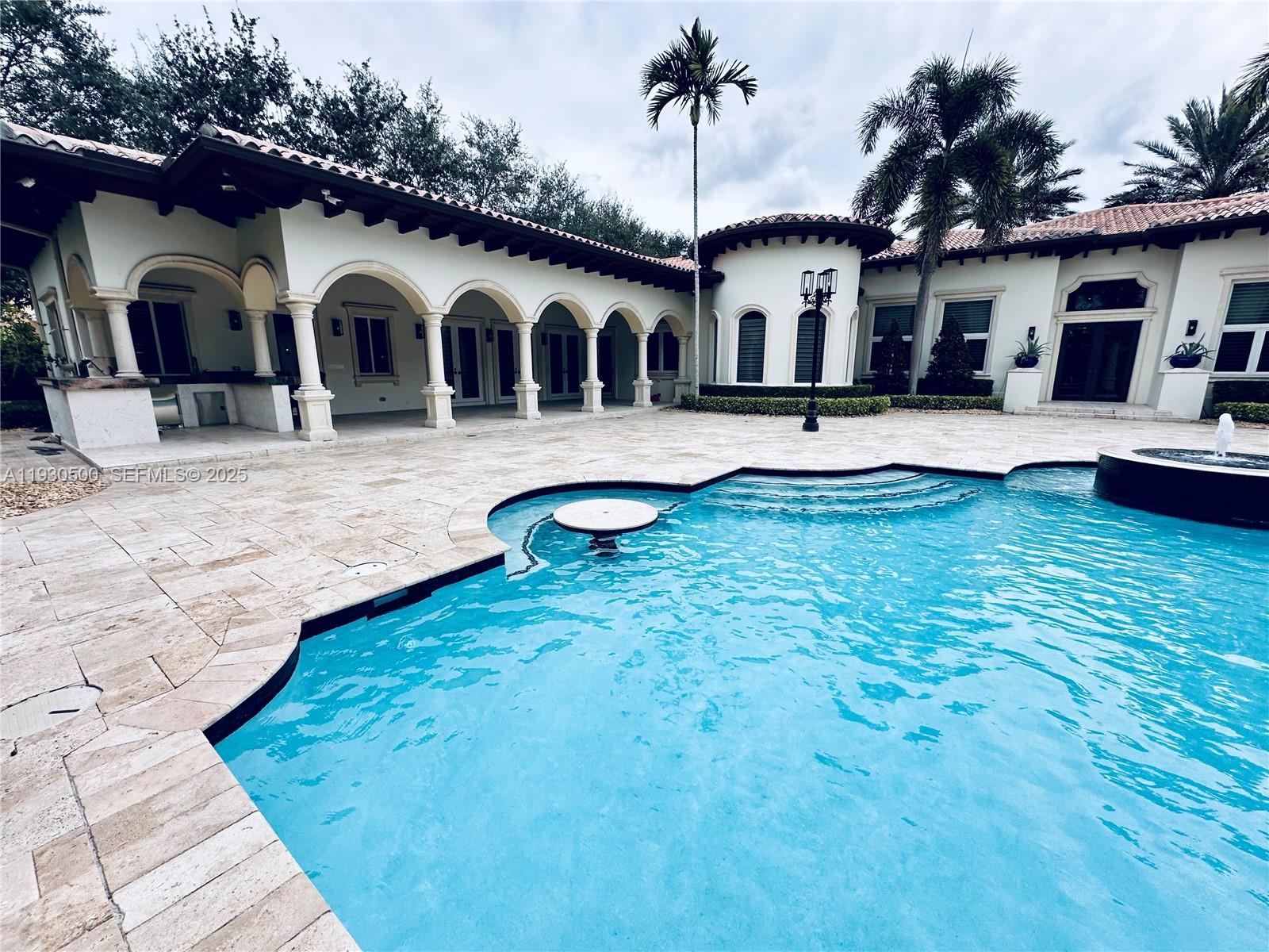 6180 Southwest 132nd Street Pinecrest, FL 33156 - Photo 56 of 75 a front view of house with yard