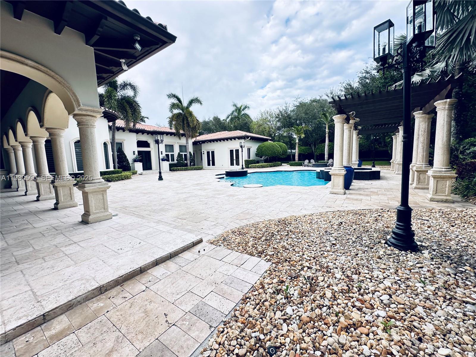 6180 Southwest 132nd Street Pinecrest, FL 33156 - Photo 58 of 75 a view of a house with a yard