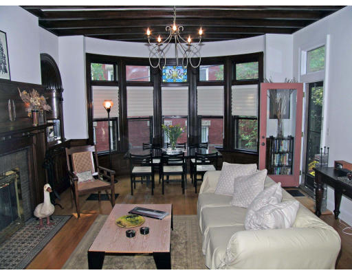 124 Winthrop Road, Unit 2 Brookline, MA 02445 - Photo 3 of 14 a living room with furniture a chandelier and a floor to ceiling window