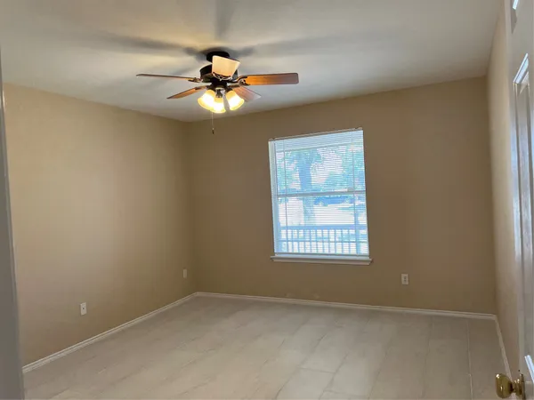 a bathroom with a toilet and shower