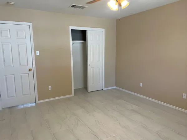 a view of an empty room with a window