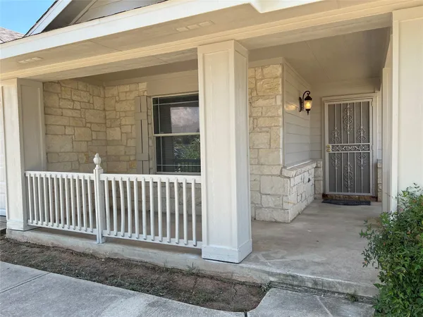 a porch with a chair