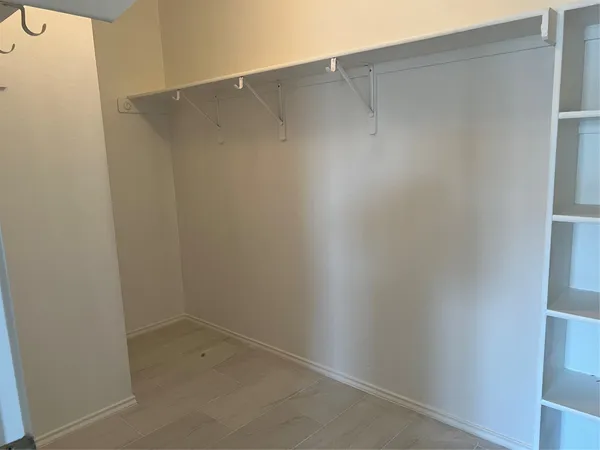 a bathroom with a granite countertop toilet and sink