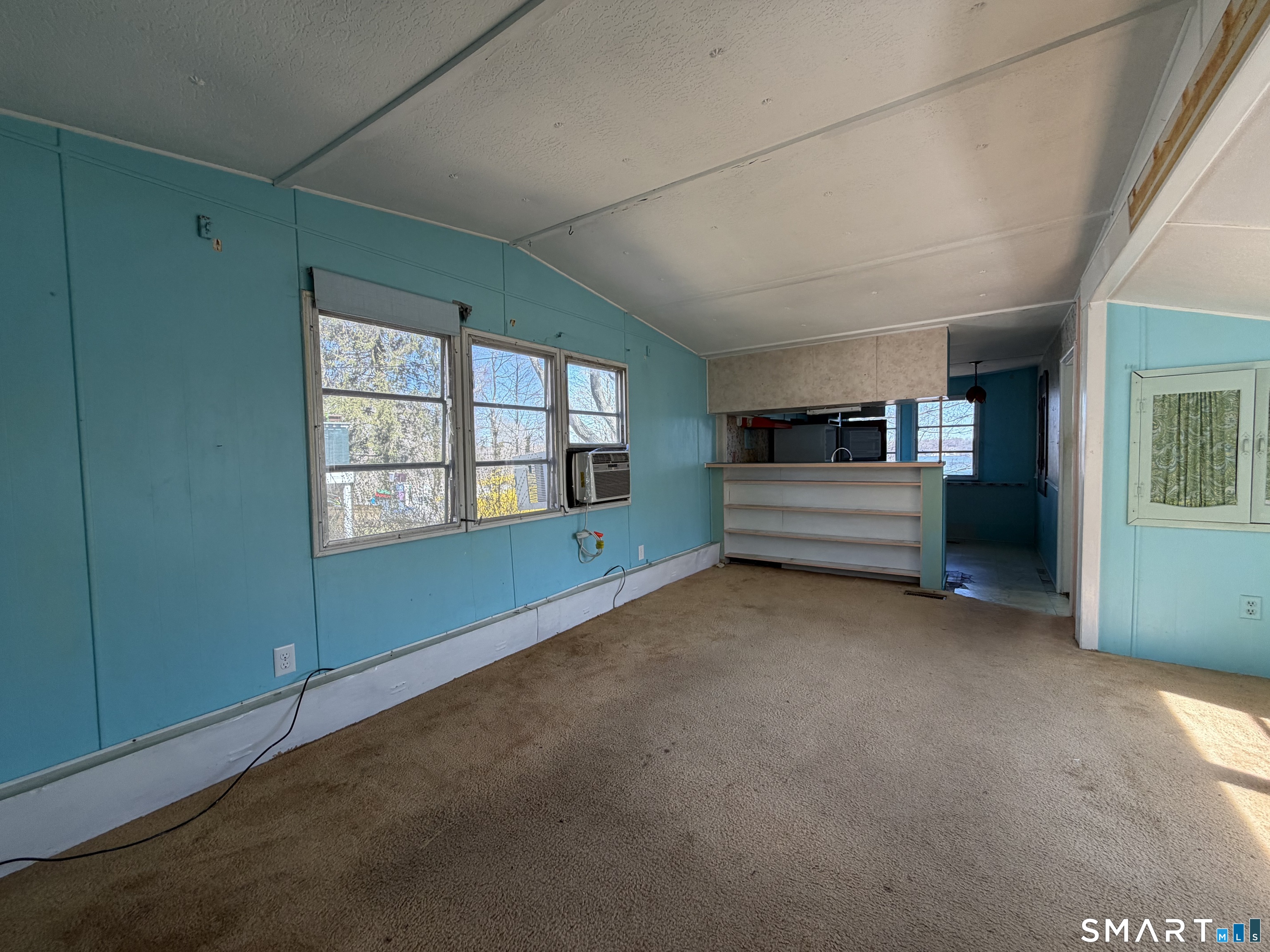 14 Mountainview Road East Hampton, CT 06424 - Photo 7 of 26 a view of an empty room with a window and fireplace