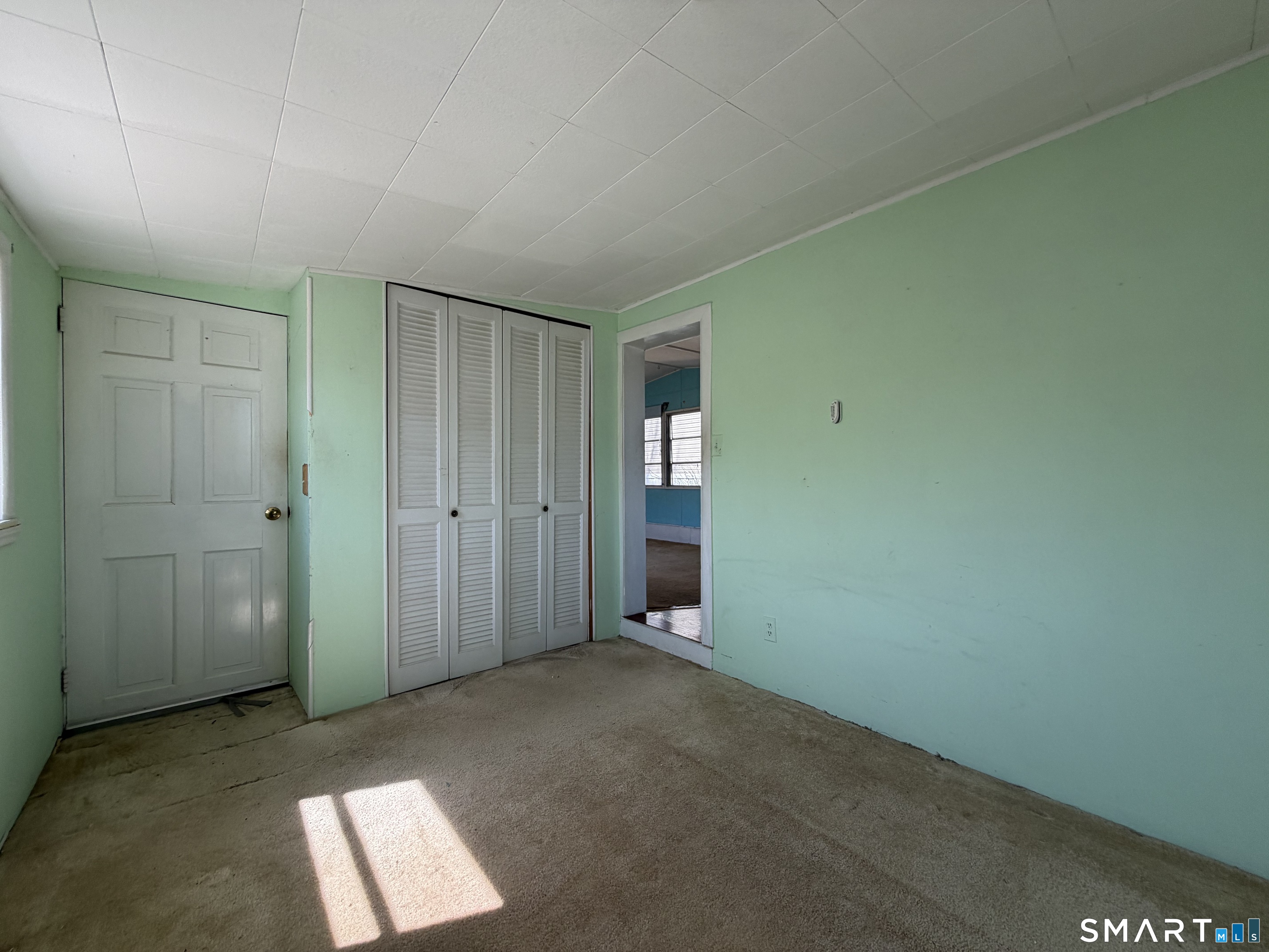 14 Mountainview Road East Hampton, CT 06424 - Photo 10 of 26 an empty room with windows