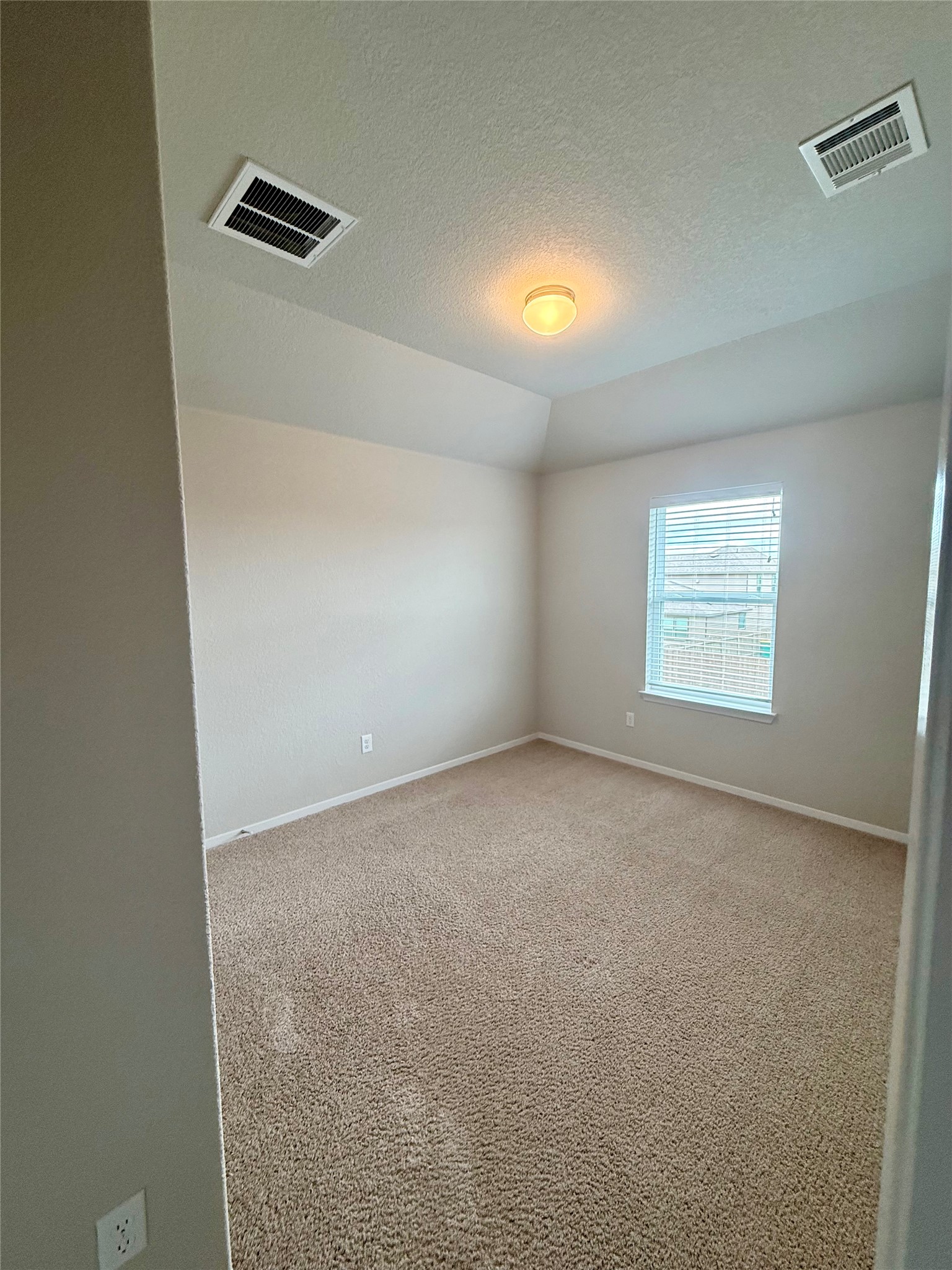 212 Lake Placid Run Elgin, TX 78621 - Photo 19 of 27 A well-proportioned bedroom with ample natural light offers a comfortable retreat.