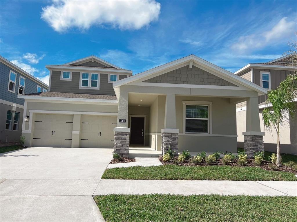 16436 Parable Way Winter Garden, FL 34787 - Photo 1 of 1 a front view of a house with a yard