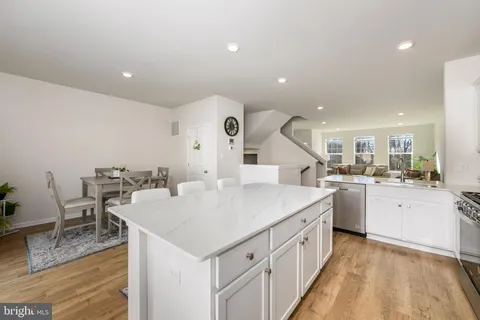 a kitchen with sink and cabinets