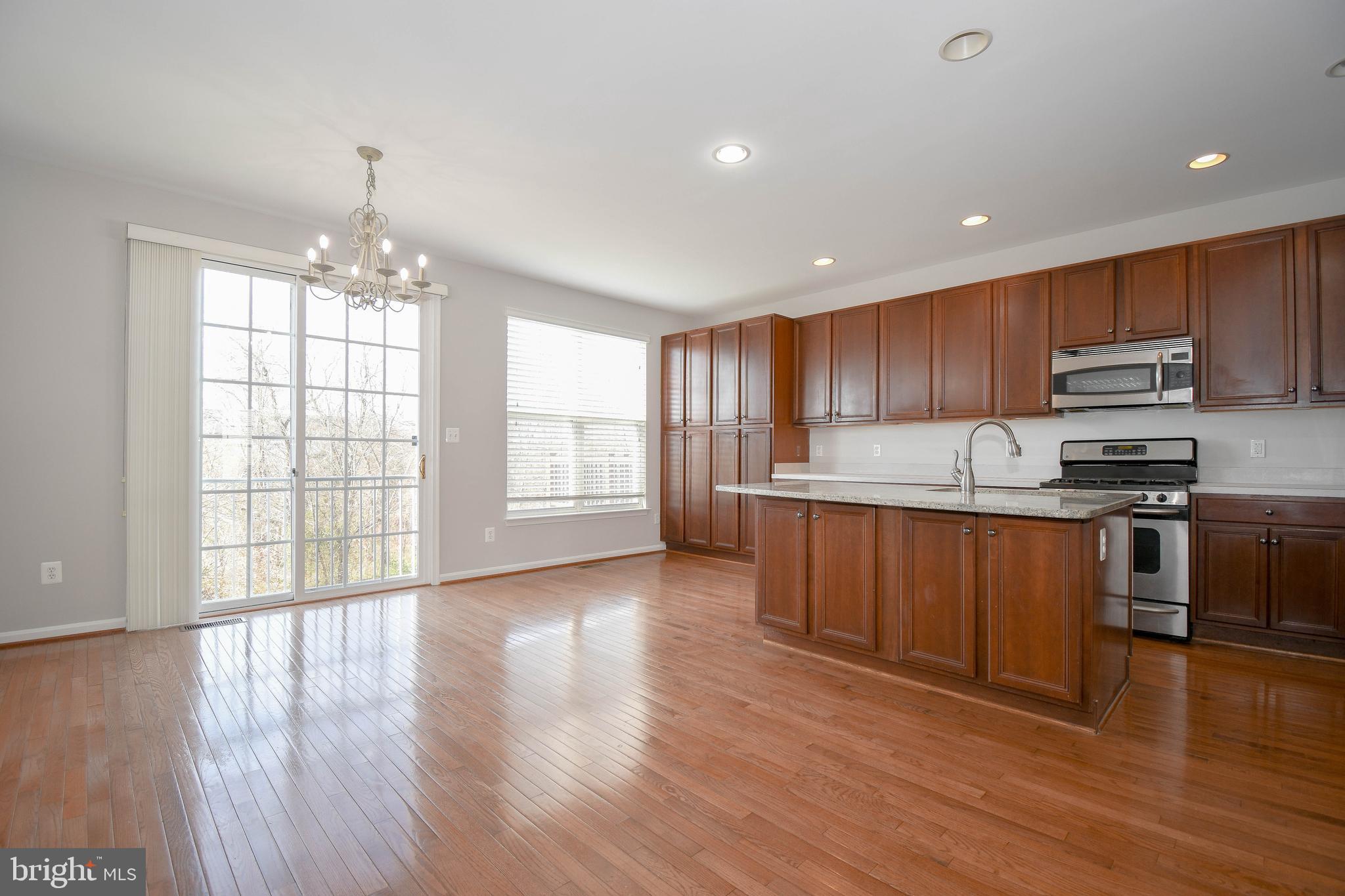 9045 Ribbon Falls Loop Bristow, VA 20136 - Photo 14 of 41 Gourmet kitchen w/ island and dining area