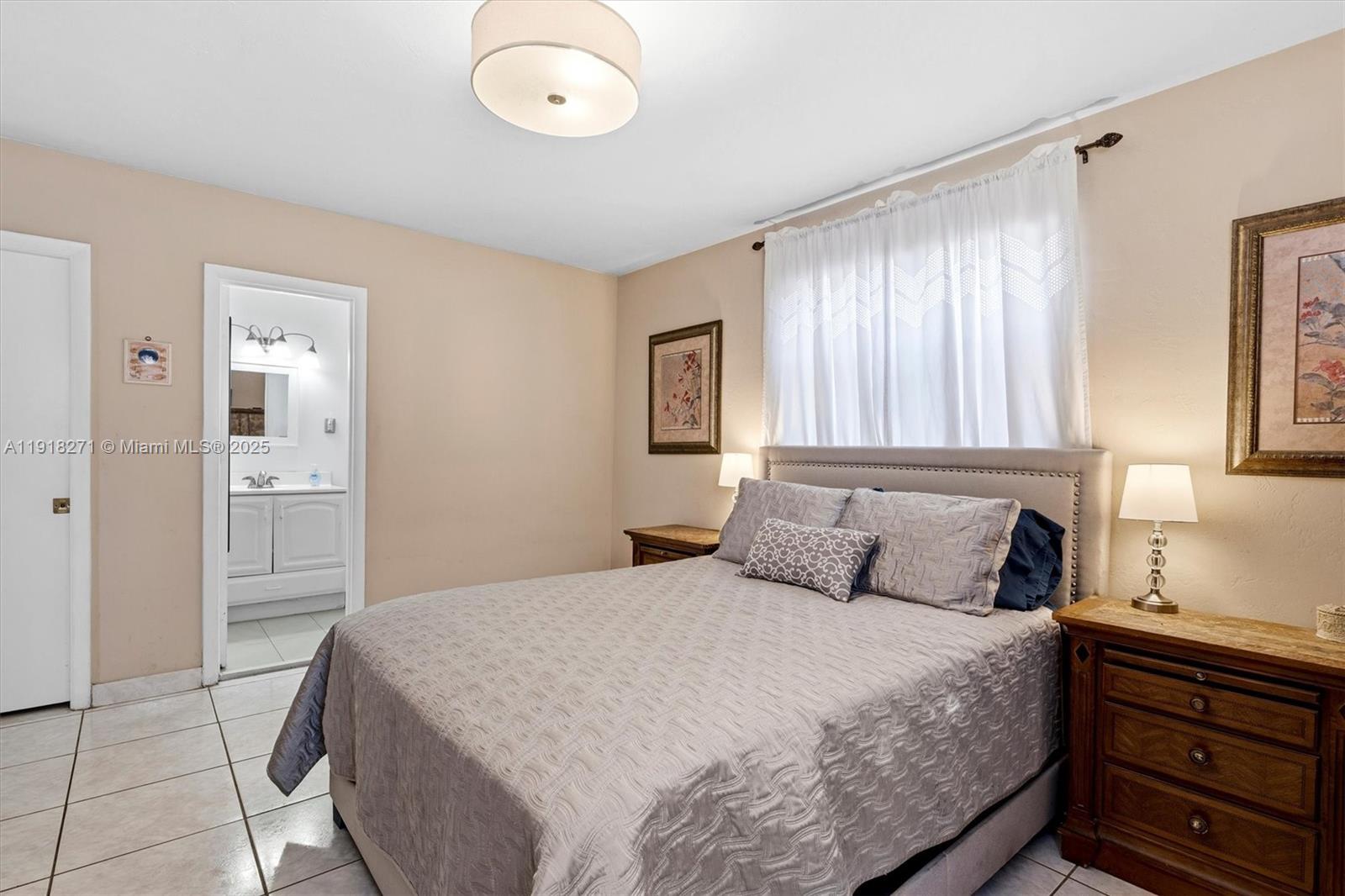 9411 Southwest 30th Terrace Miami, FL 33165 - Photo 14 of 42 a bedroom with a bed and a window