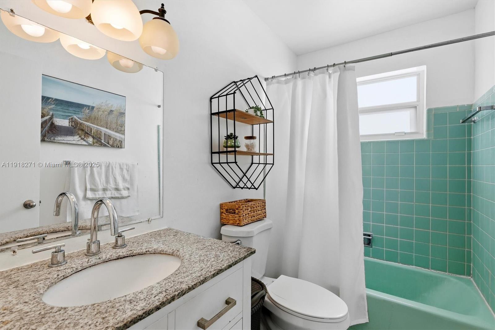 9411 Southwest 30th Terrace Miami, FL 33165 - Photo 18 of 42 a bathroom with a granite countertop sink a toilet and shower