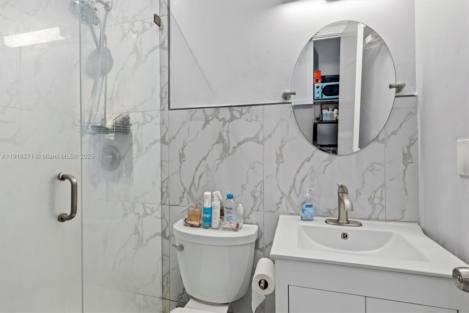 9411 Southwest 30th Terrace Miami, FL 33165 - Photo 23 of 42 a bathroom with a sink a toilet and shower