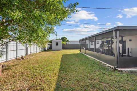 a view of backyard with large trees