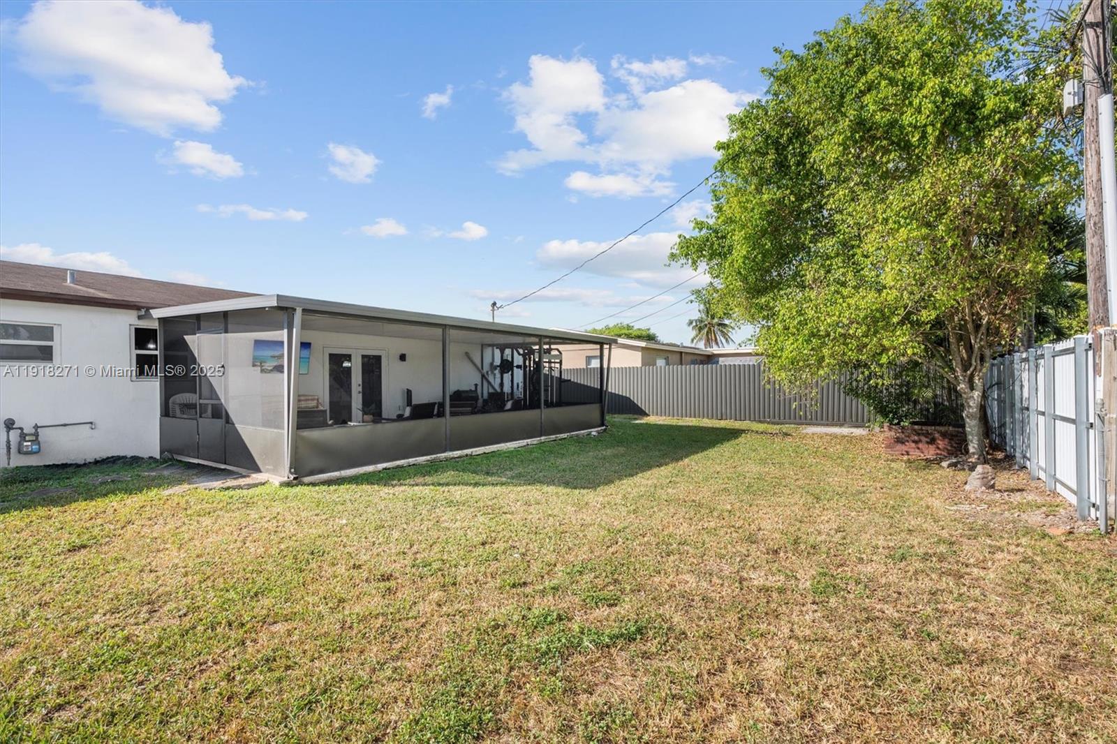 9411 Southwest 30th Terrace Miami, FL 33165 - Photo 27 of 42 a view of an house with backyard and garage
