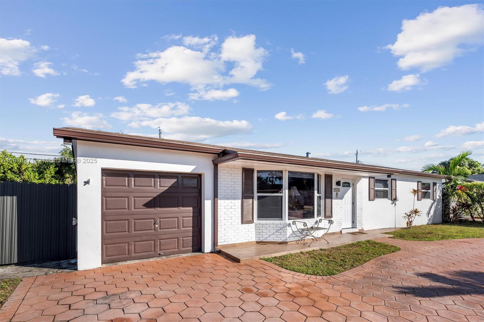 9411 Southwest 30th Terrace Miami, FL 33165 - Photo 35 of 42 a front view of a house with garden